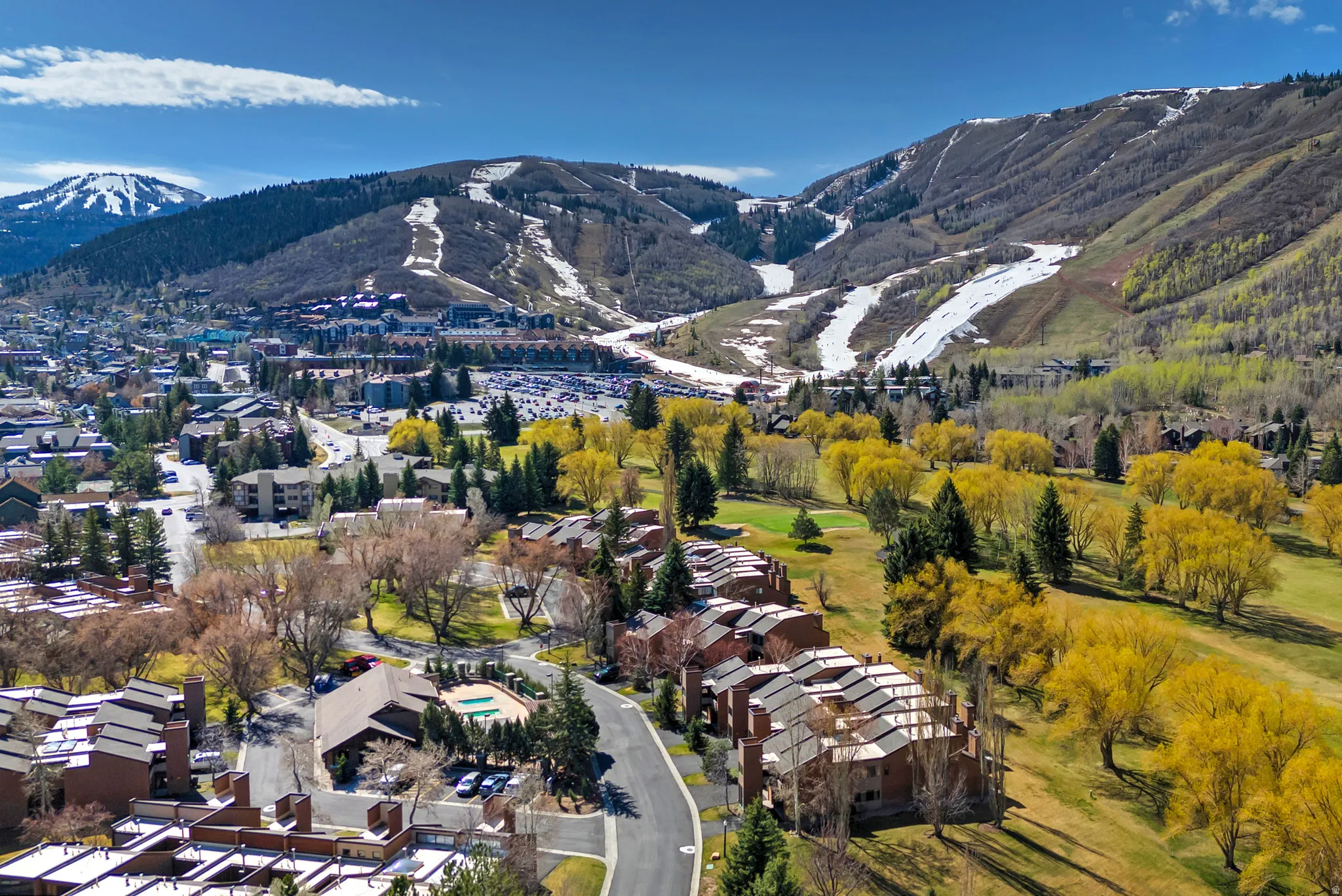 Expansive aerial perspective showcasing a mountainous landscape with ski slopes