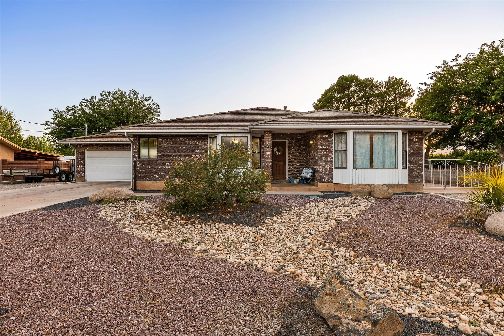 Front View (Wide Angle). Brick exterior residence with an attached two-car garage