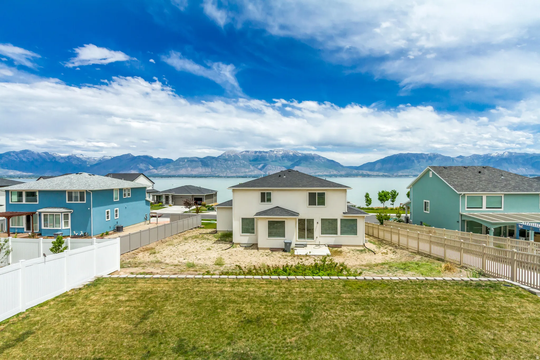Expansive backyard featuring a large grass area plus a vegetable garden area at the rear of the property.