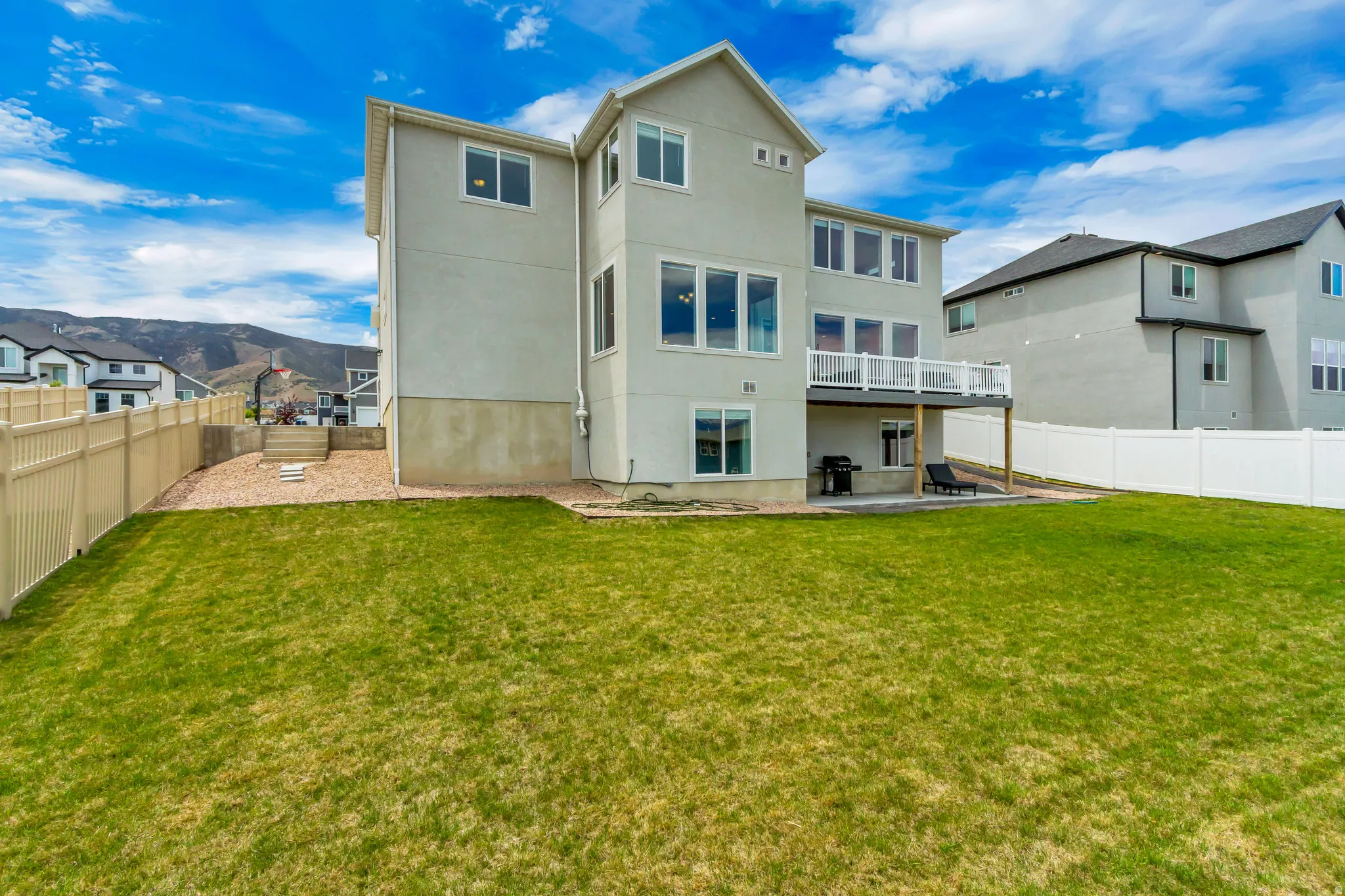 Expansive rear exterior featuring a two-story design with lots of windows