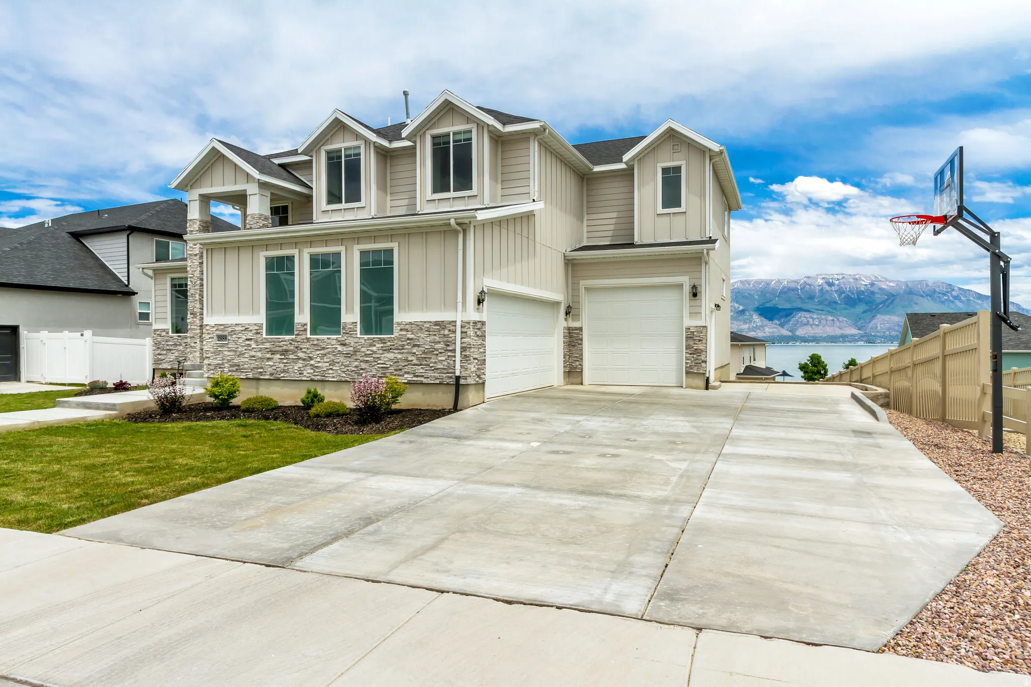 3 car garage includes a 2 car garage plus an oversized garage for a boat and toys. Extra concrete for long third driveway.