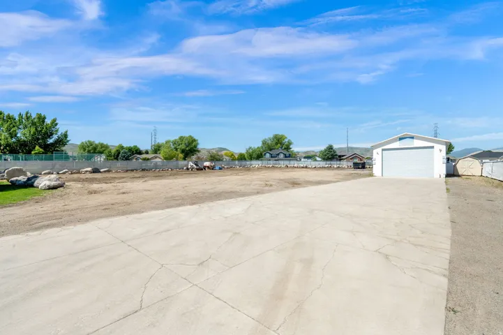 Expansive concrete pad serving a large detached garage structure