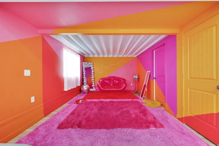 Photo Studio - Vibrantly painted interior with contrasting geometric wall designs