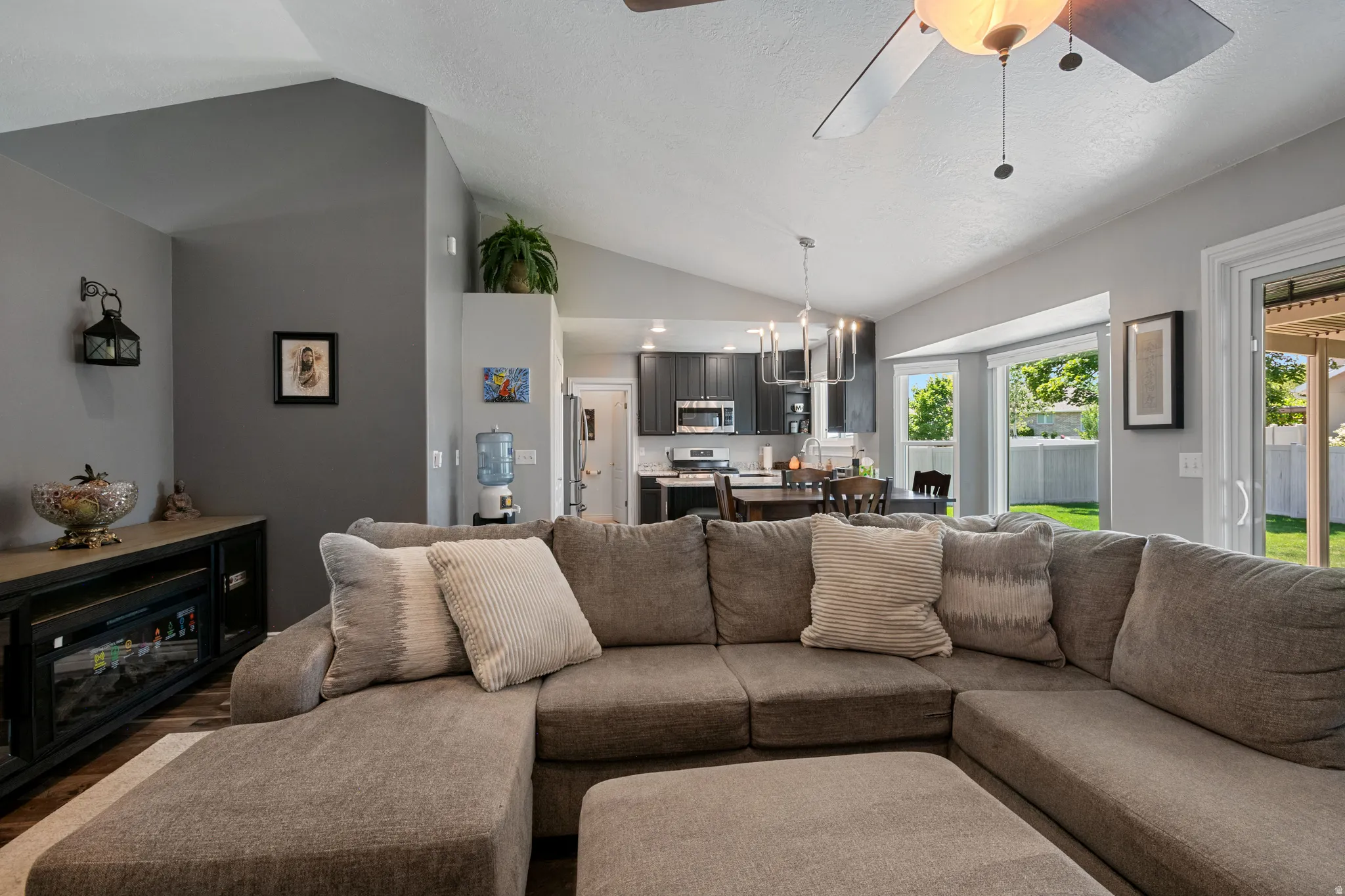 Vaulted ceiling in the living area with a ceiling fan