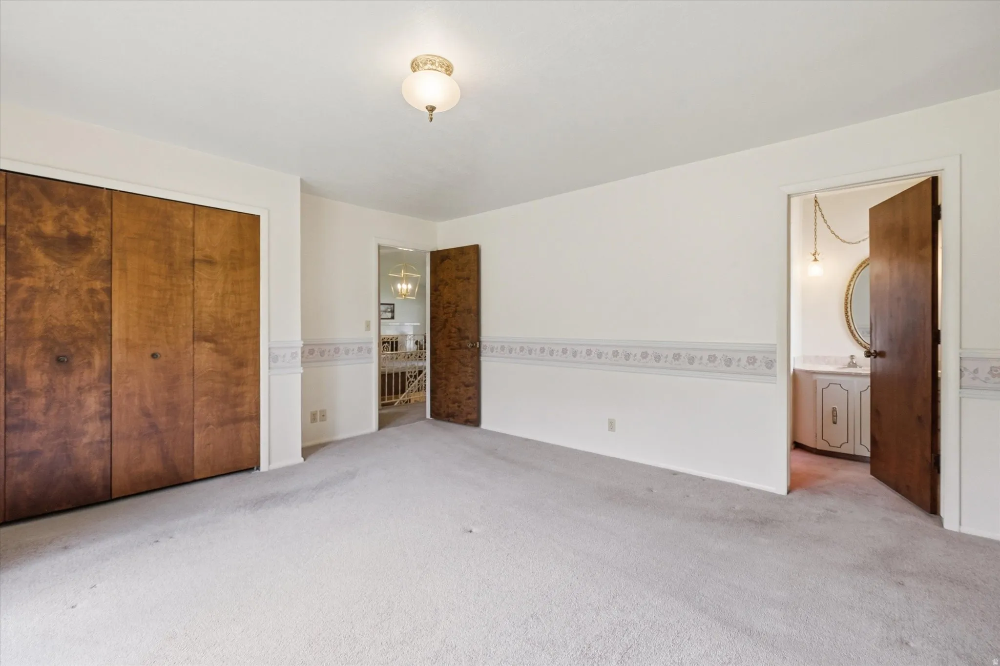 Wall-to-wall carpeting and neutral wall tones