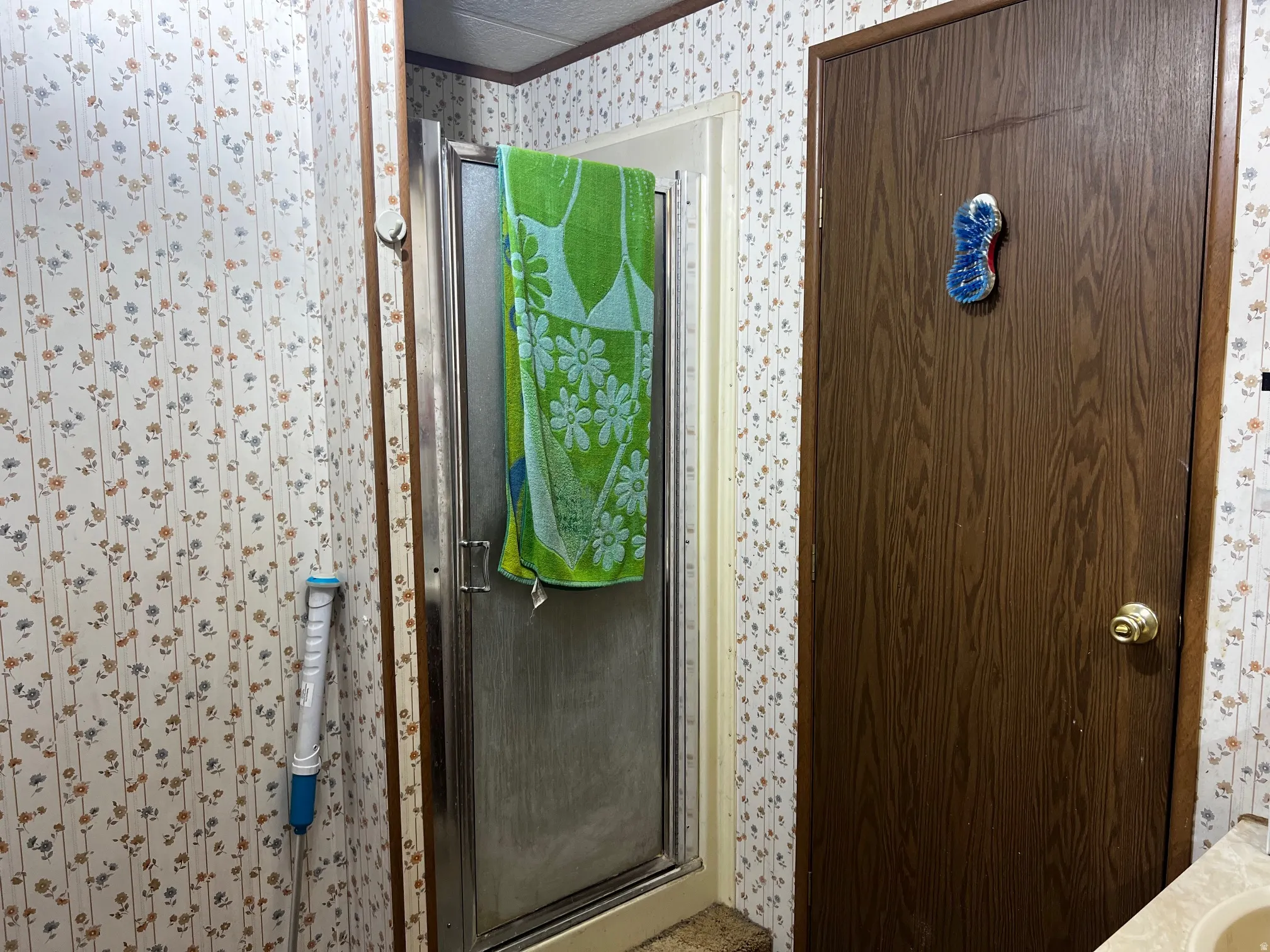 Shower enclosure with frosted glass panels and chrome framing