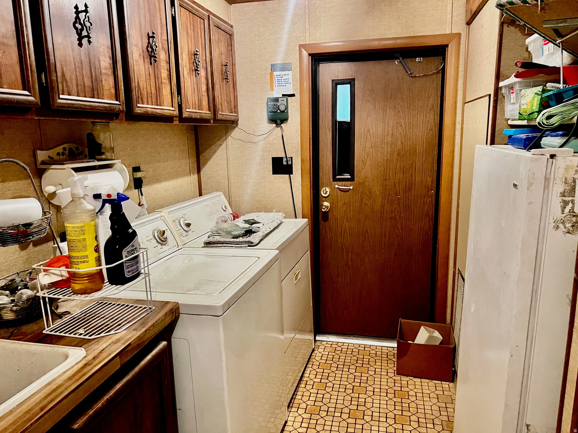 Dedicated laundry area featuring a white washing machine and dryer