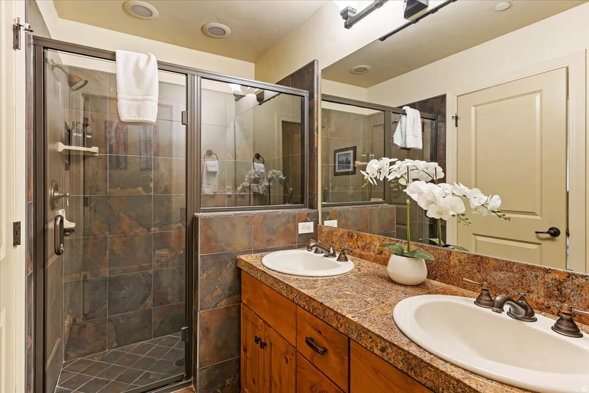 Dual vanity with undermount sinks and bronze-finish fixtures
