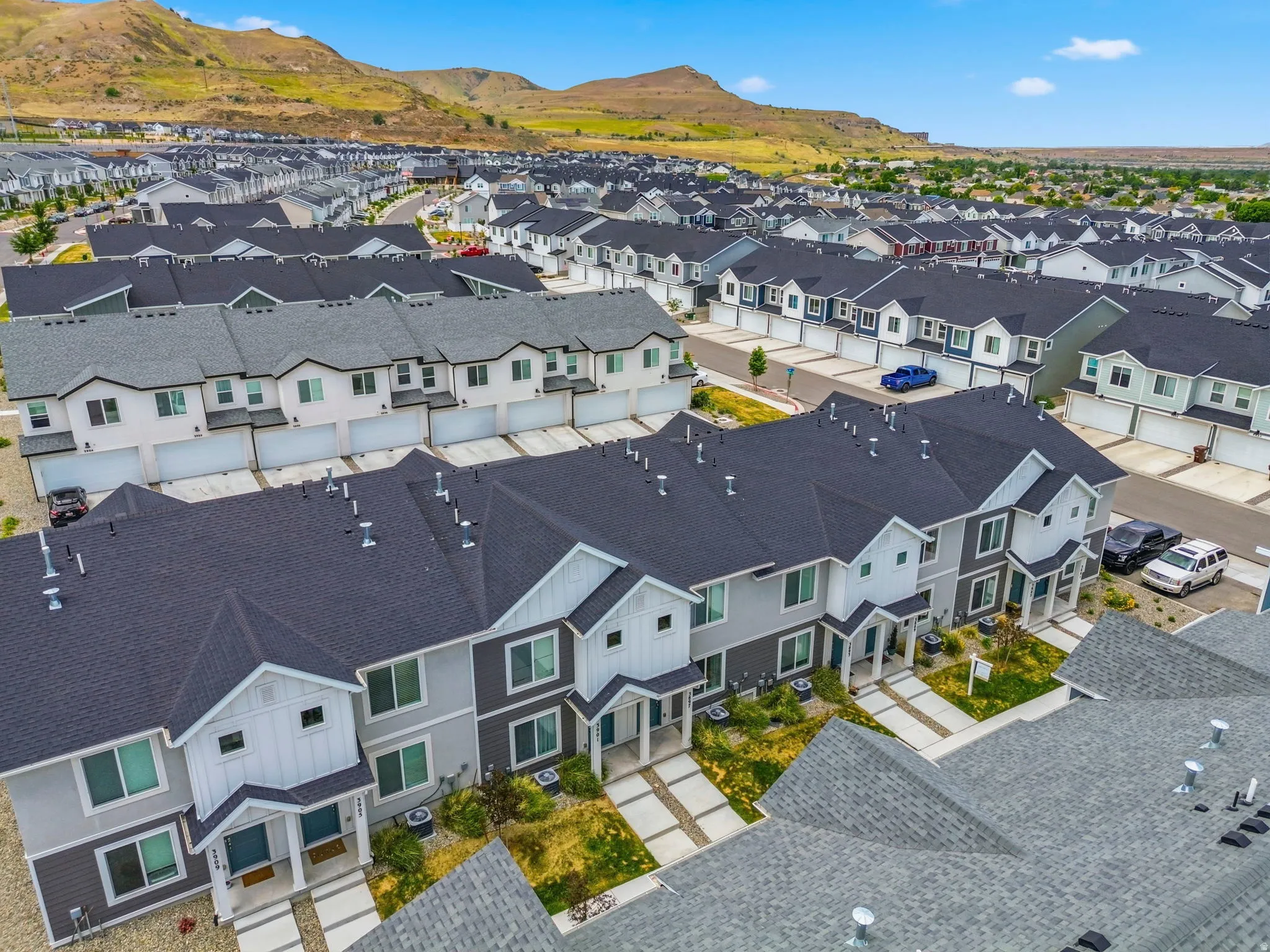 Contemporary townhome community featuring multi-story units with attached garages