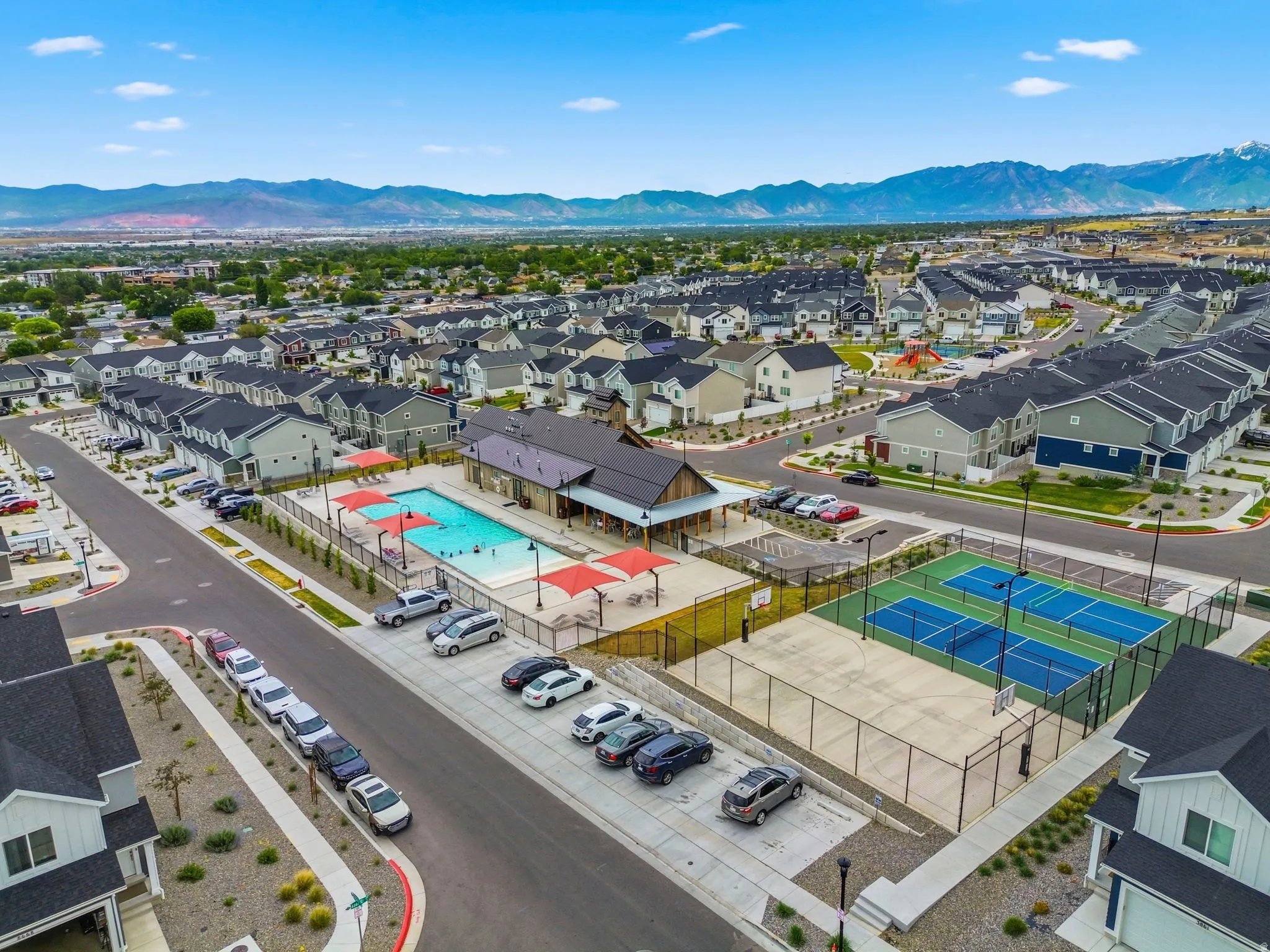 Community amenities featuring a swimming pool, clubhouse, and tennis/pickball/basketball courts