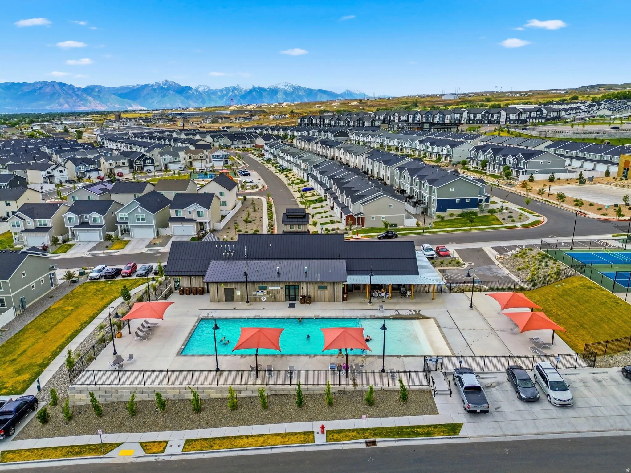 Community amenities featuring a swimming pool, clubhouse, and tennis/pickball/basketball courts