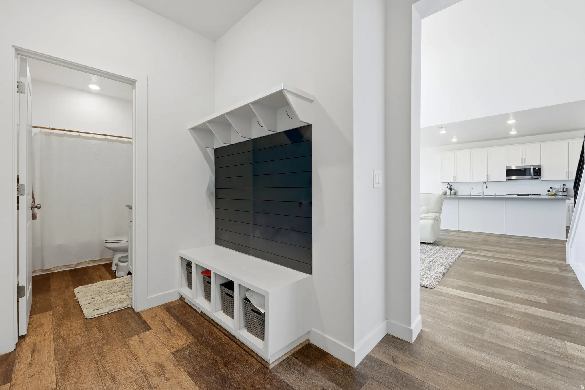Entryway featuring built-in storage with hooks and cubbies