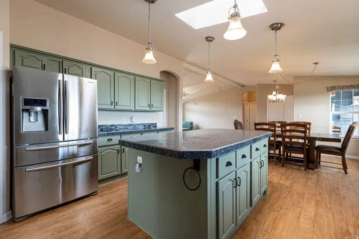 Kitchen with center island into the dining room.