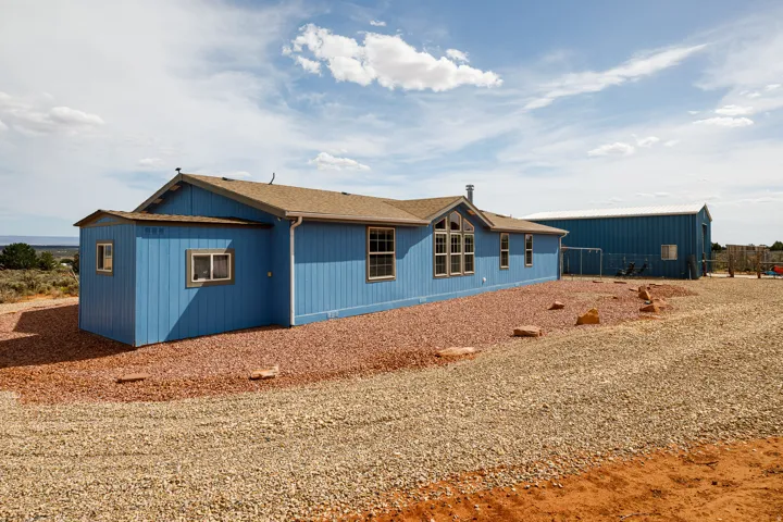Home exterior with attached shed