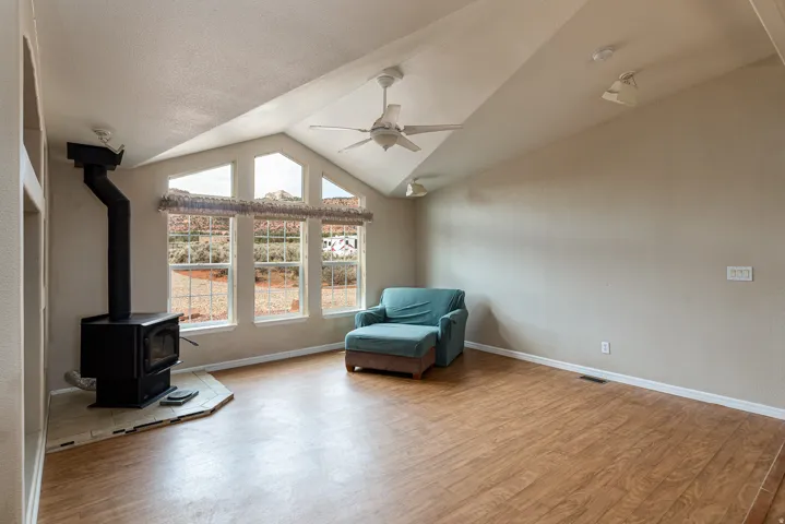 Living room, wood burning stove and Red Rock views!