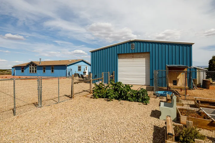 Outside view of home, shop and garden area.