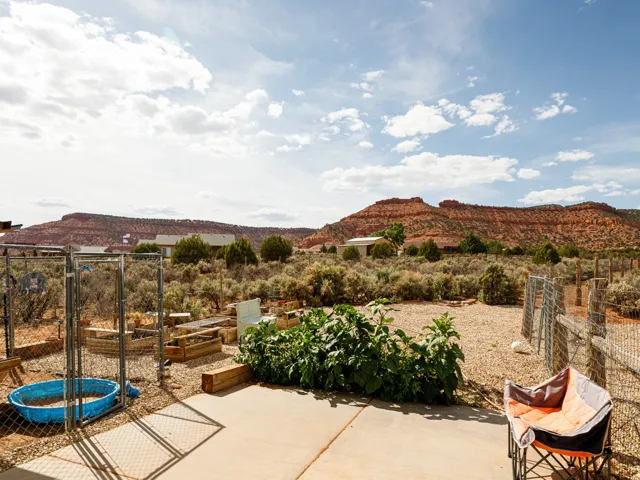 Garden area with chicken coop and fencing
