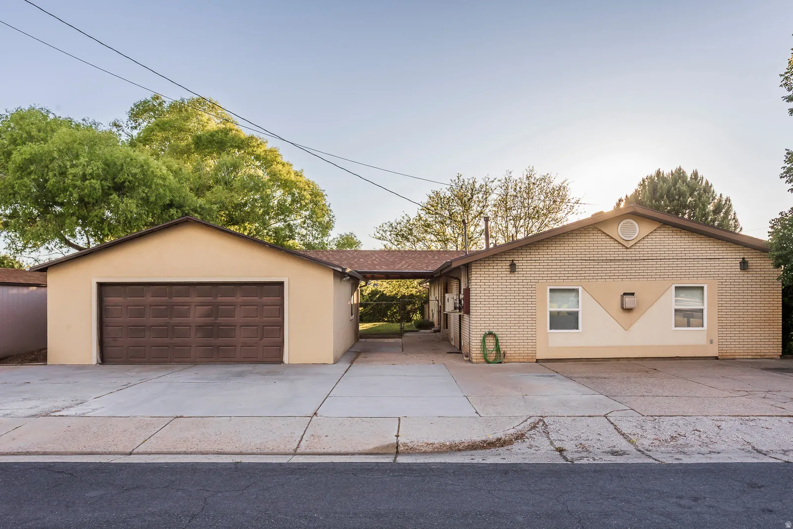 Two-car garage with a brown panel door