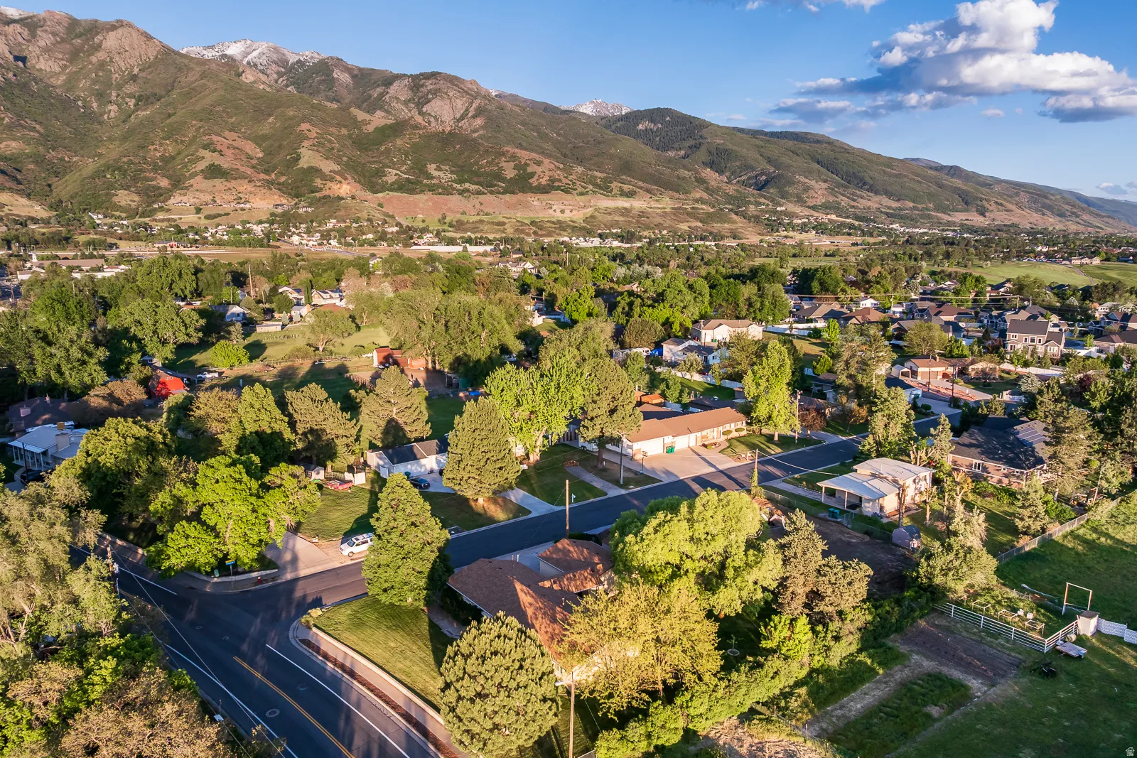 Expansive residential area featuring established homes, mature trees, and paved roads