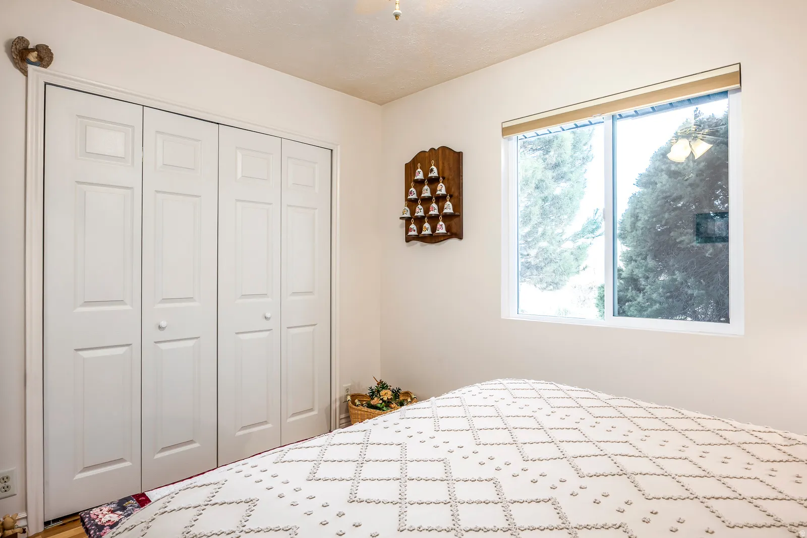 White bi-fold closet doors with panel detailing