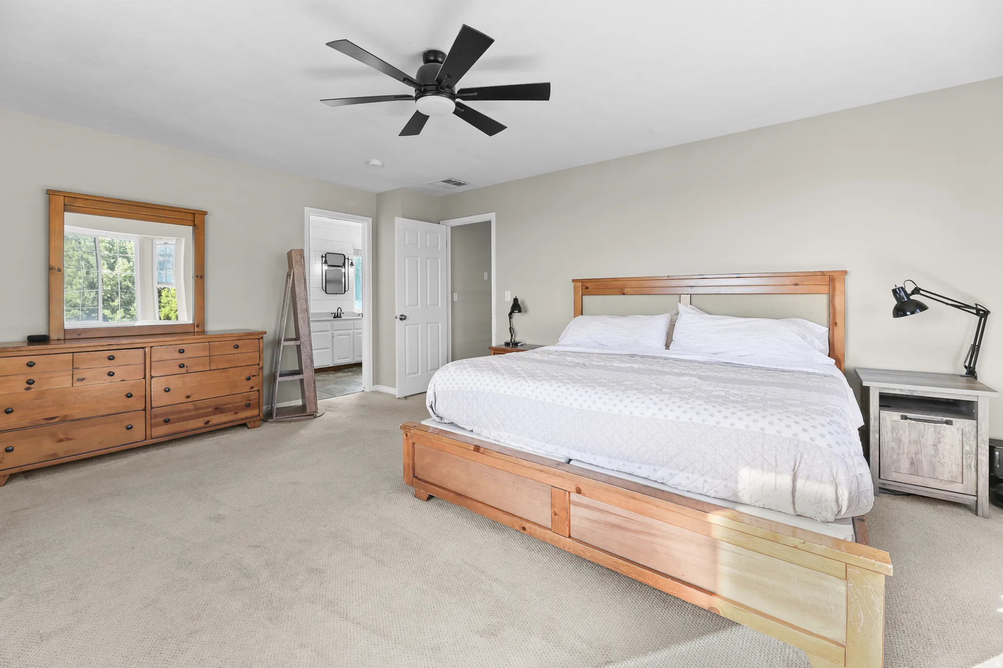 Spacious room featuring neutral carpet flooring and light-toned walls