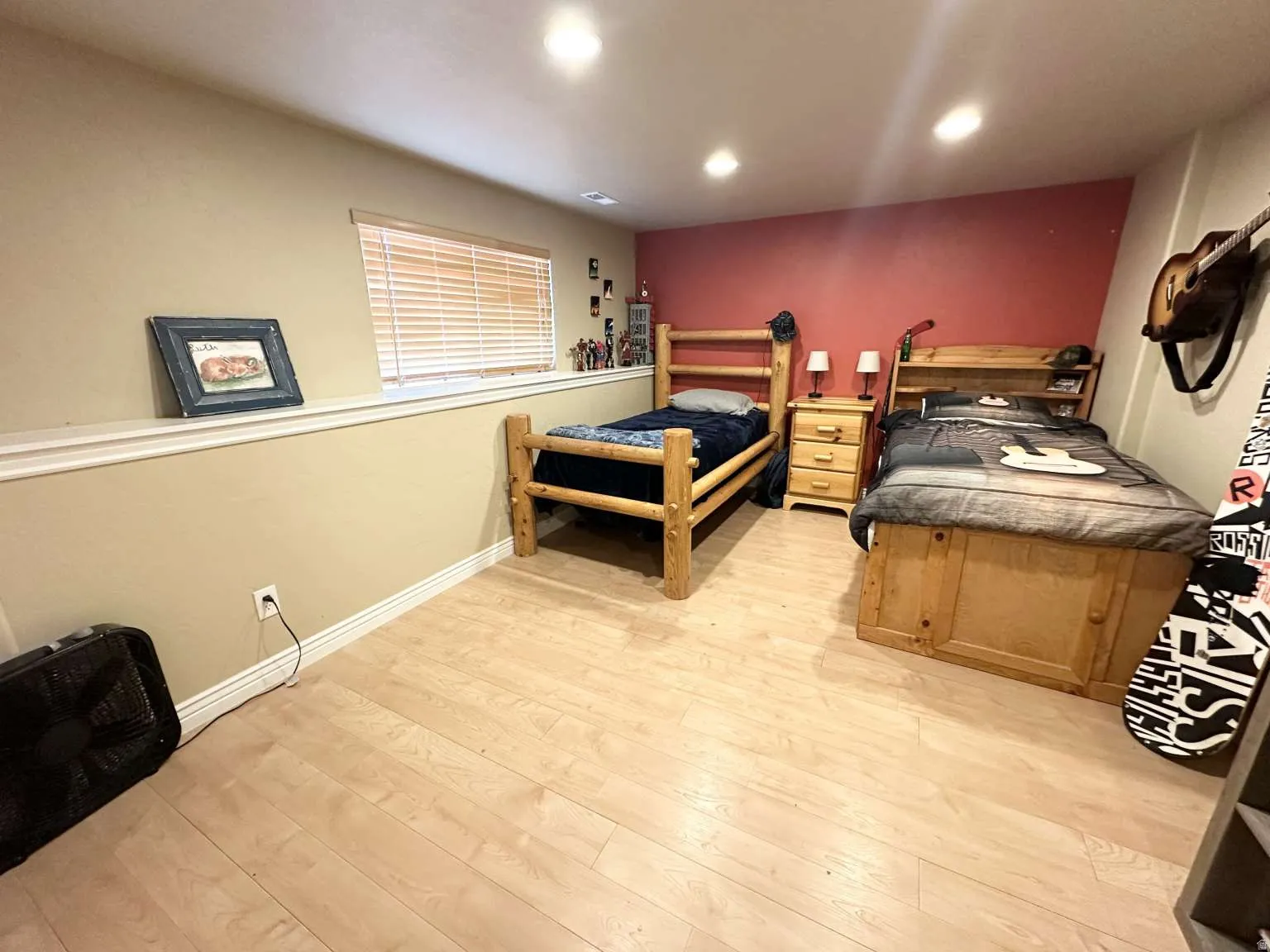 Light wood-finish flooring with recessed lighting