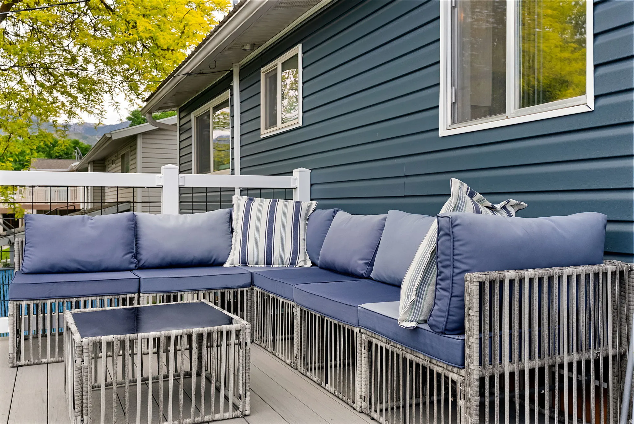 Deck with composite flooring and white railing