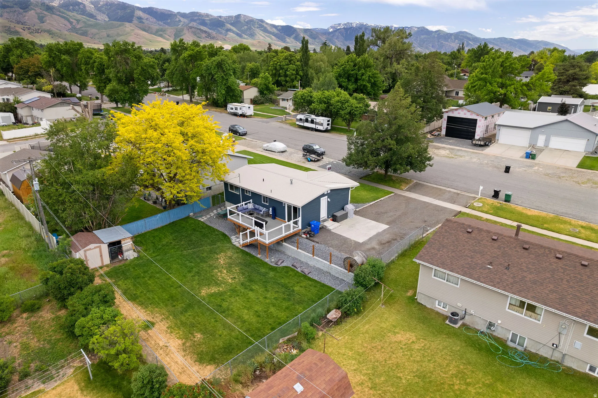 Expansive green yard space with mature trees