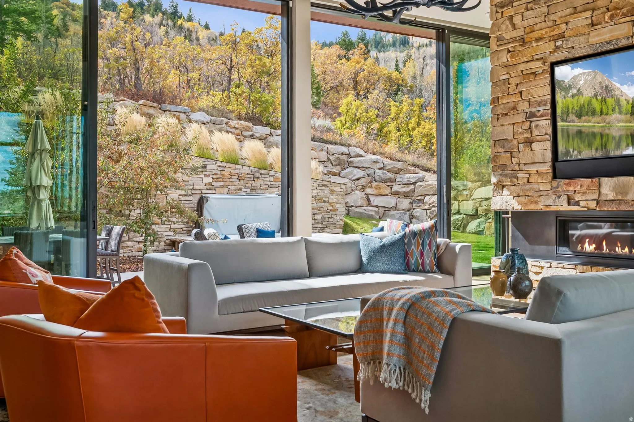 View of patio / terrace featuring an outdoor living space with a fireplace