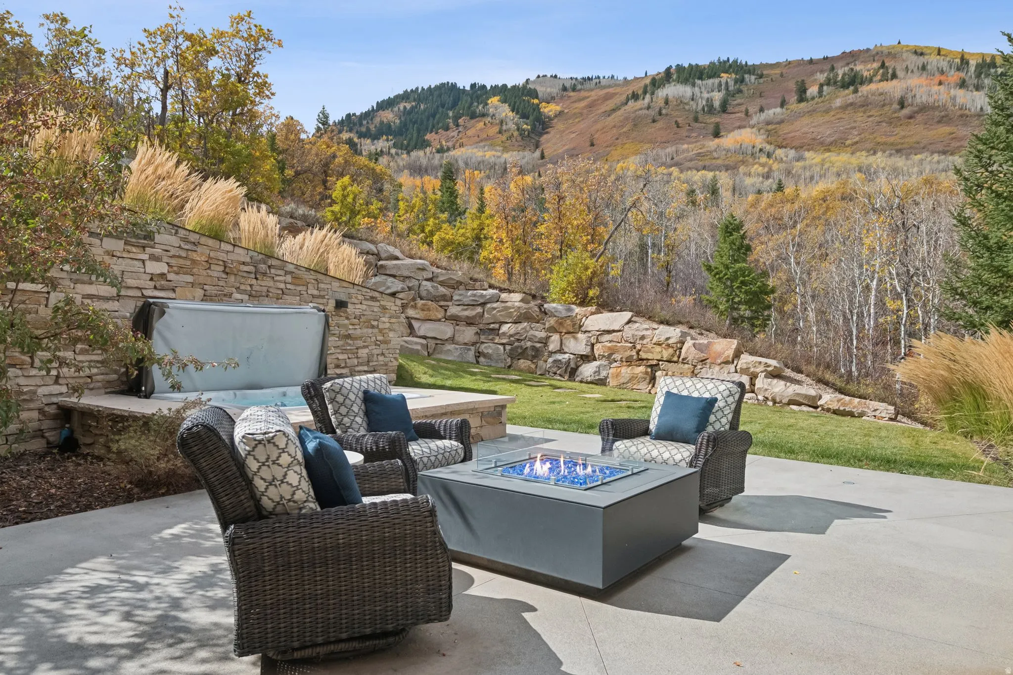 View of patio with an outdoor fire pit