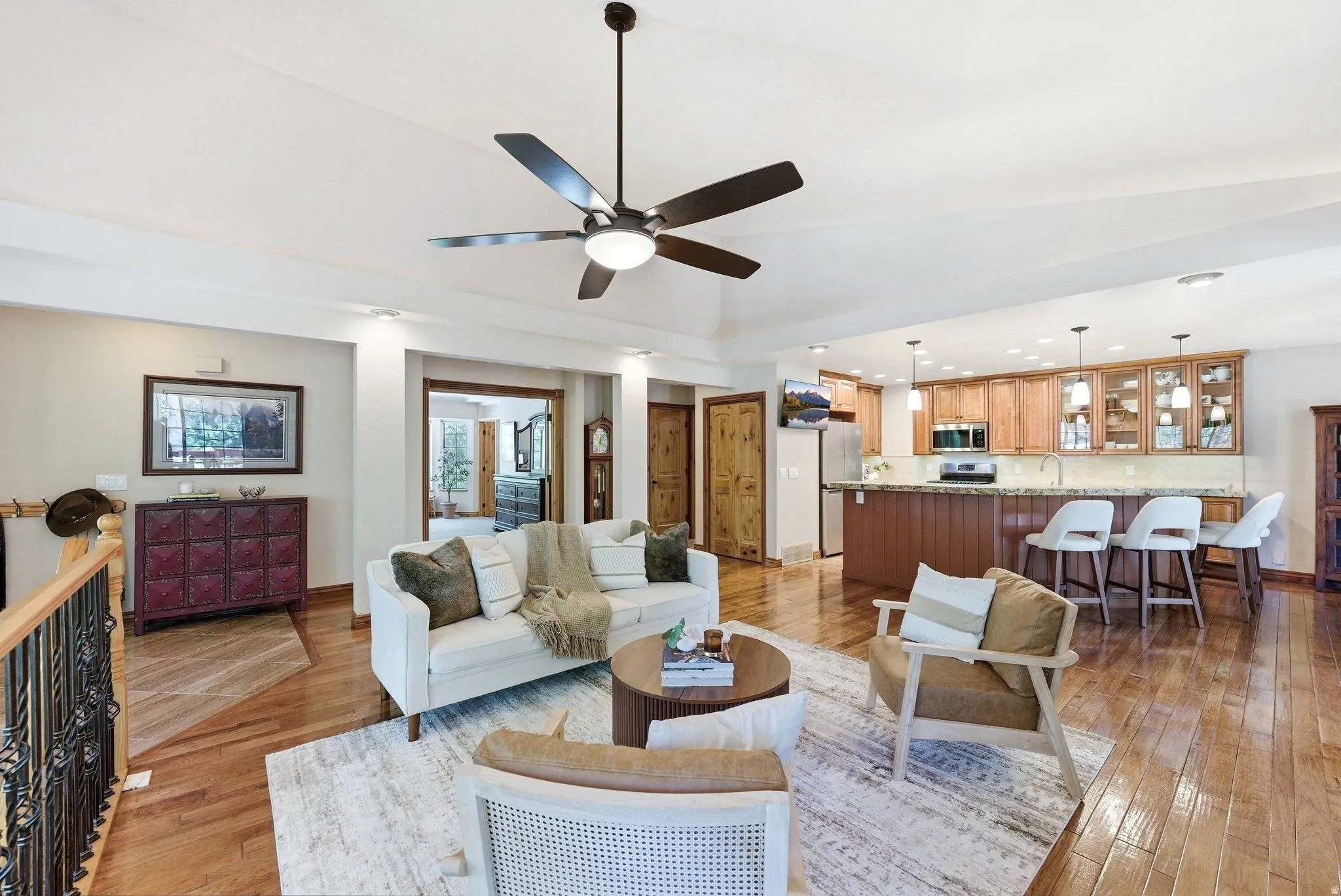 Open-concept living area featuring wood-finish flooring throughout