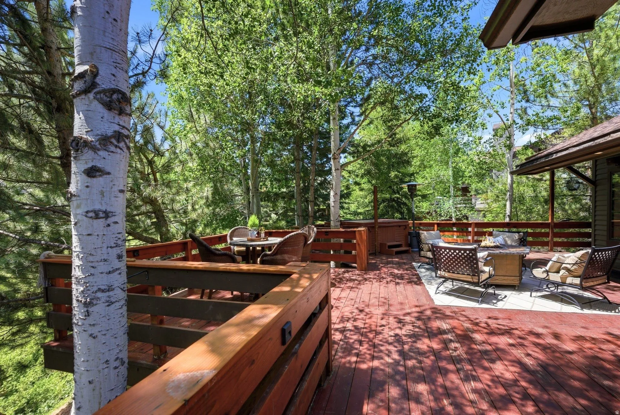 Multi-level wooden deck featuring a built-in railing system