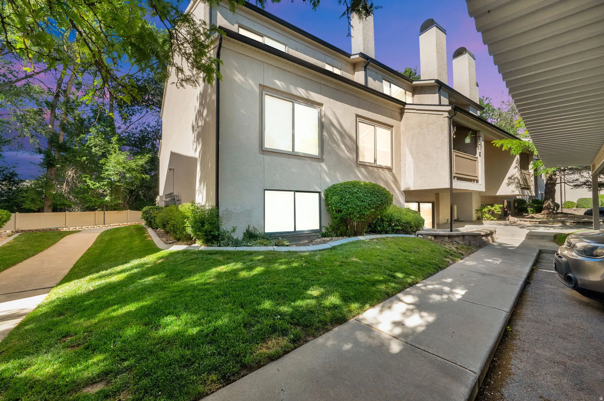 Multi-story stucco exterior with multiple windows