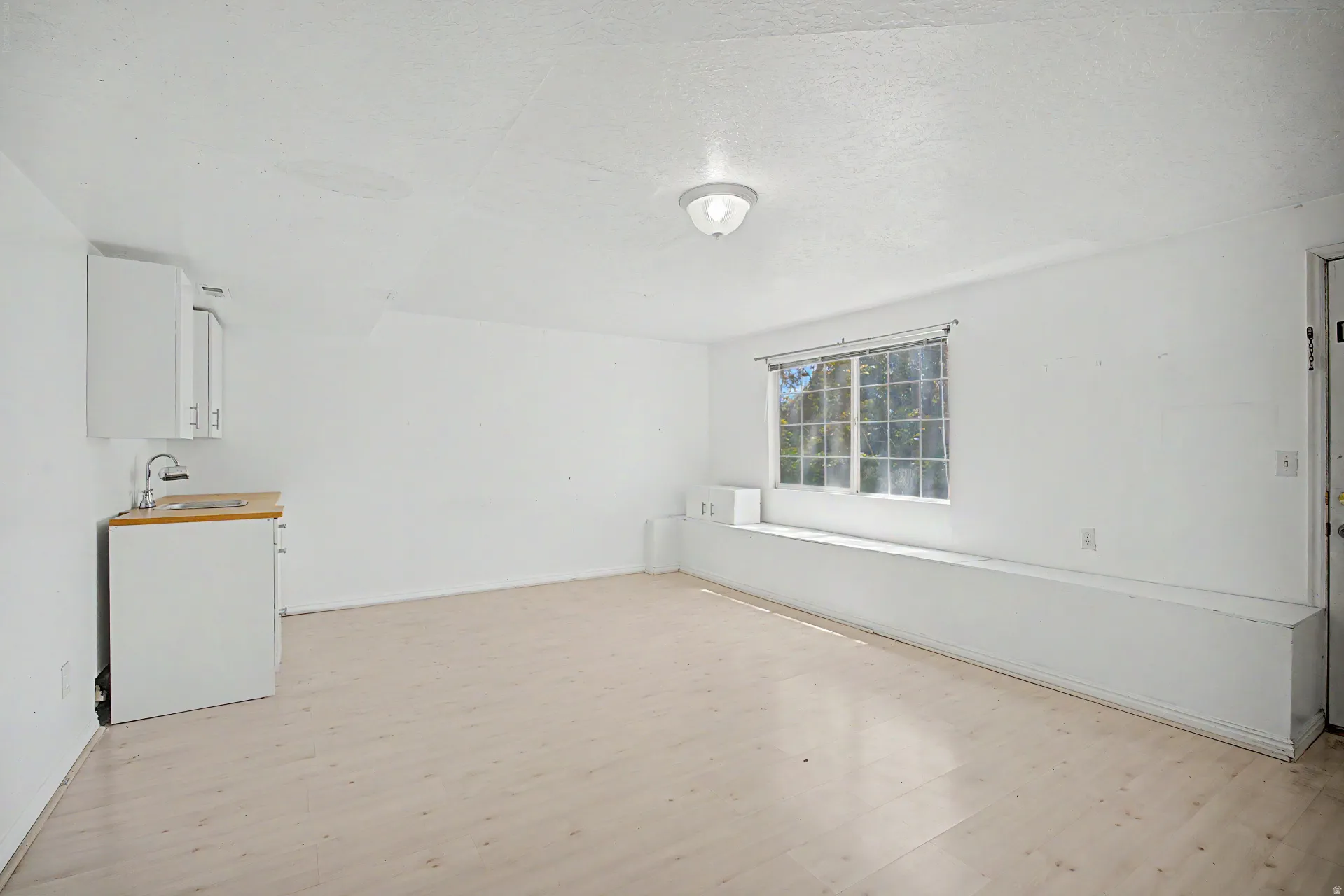 Bright interior space with light wood-finish flooring