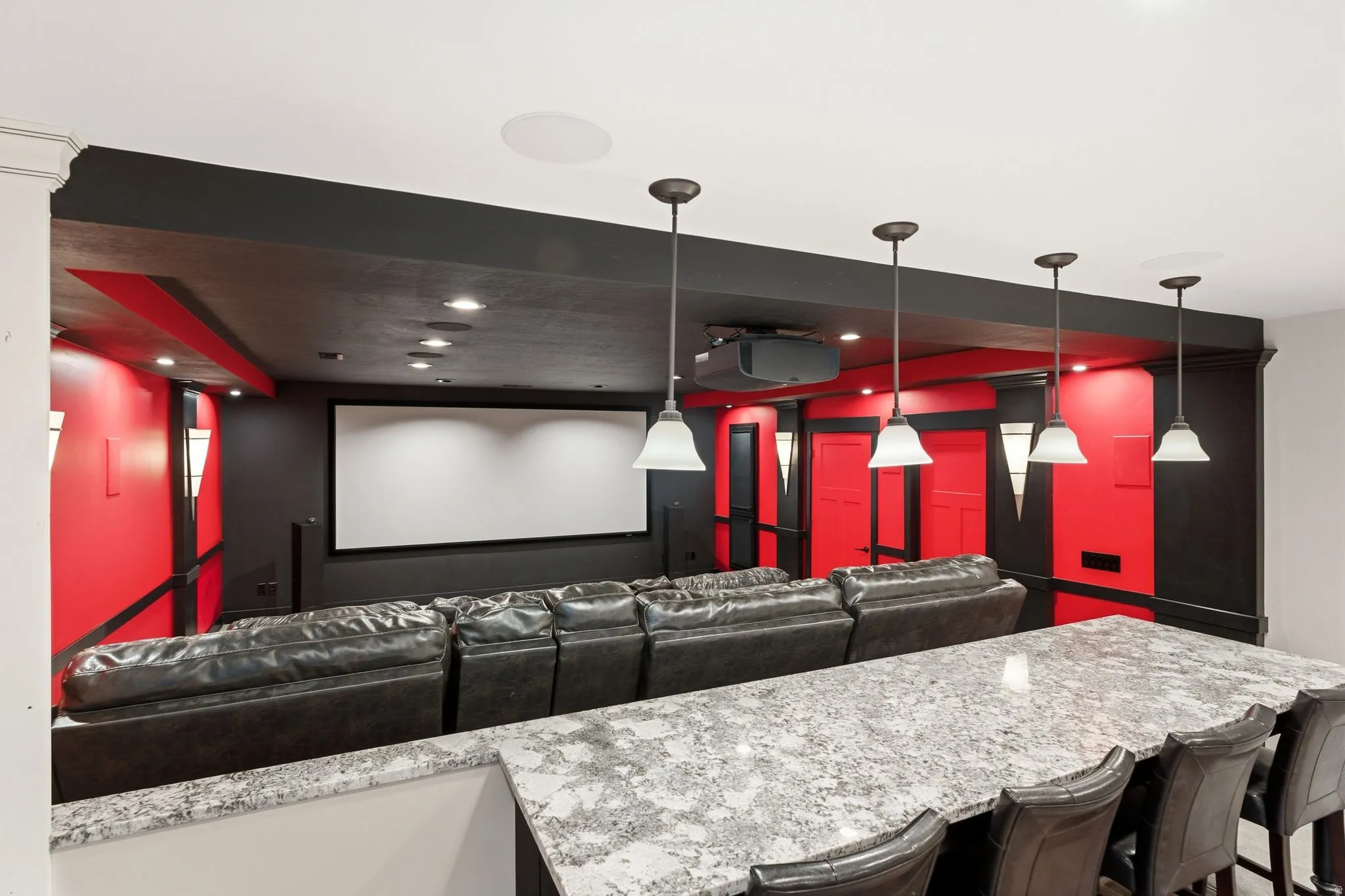 Custom entertainment space featuring an integrated projection screen and ceiling-mounted projector