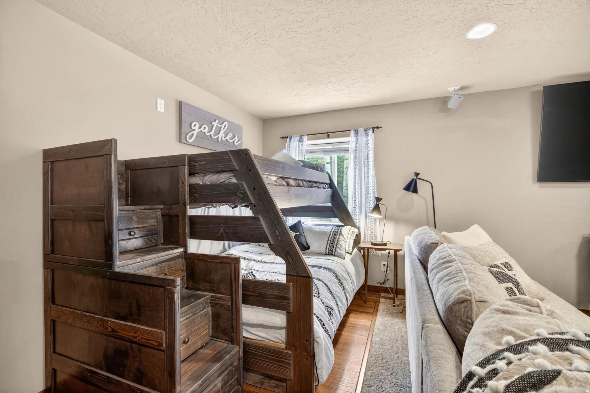 Wood-finish bunk bed with integrated staircase storage