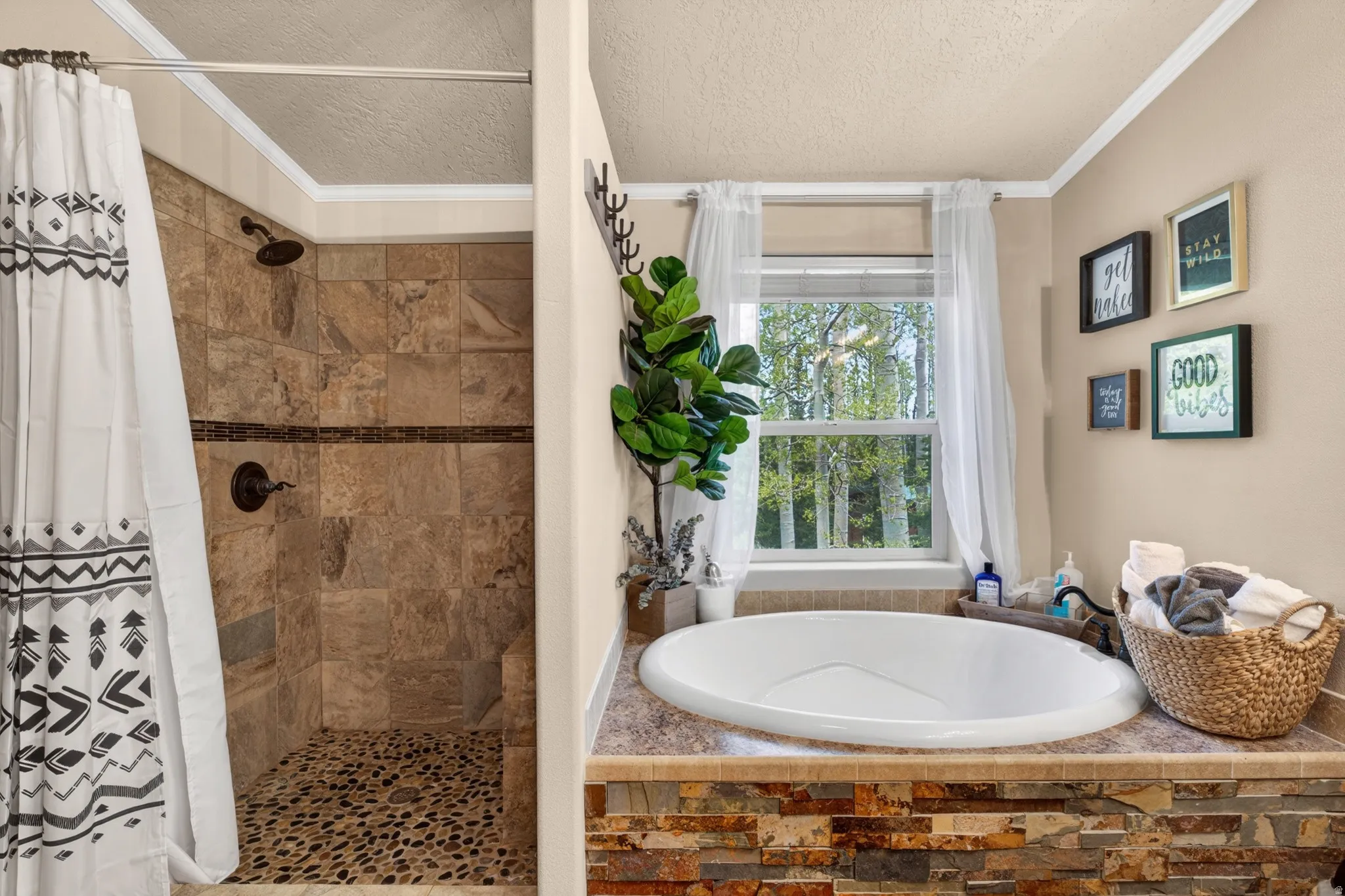 Soaking tub with a stacked stone base, a tiled surround, and a window with natural light