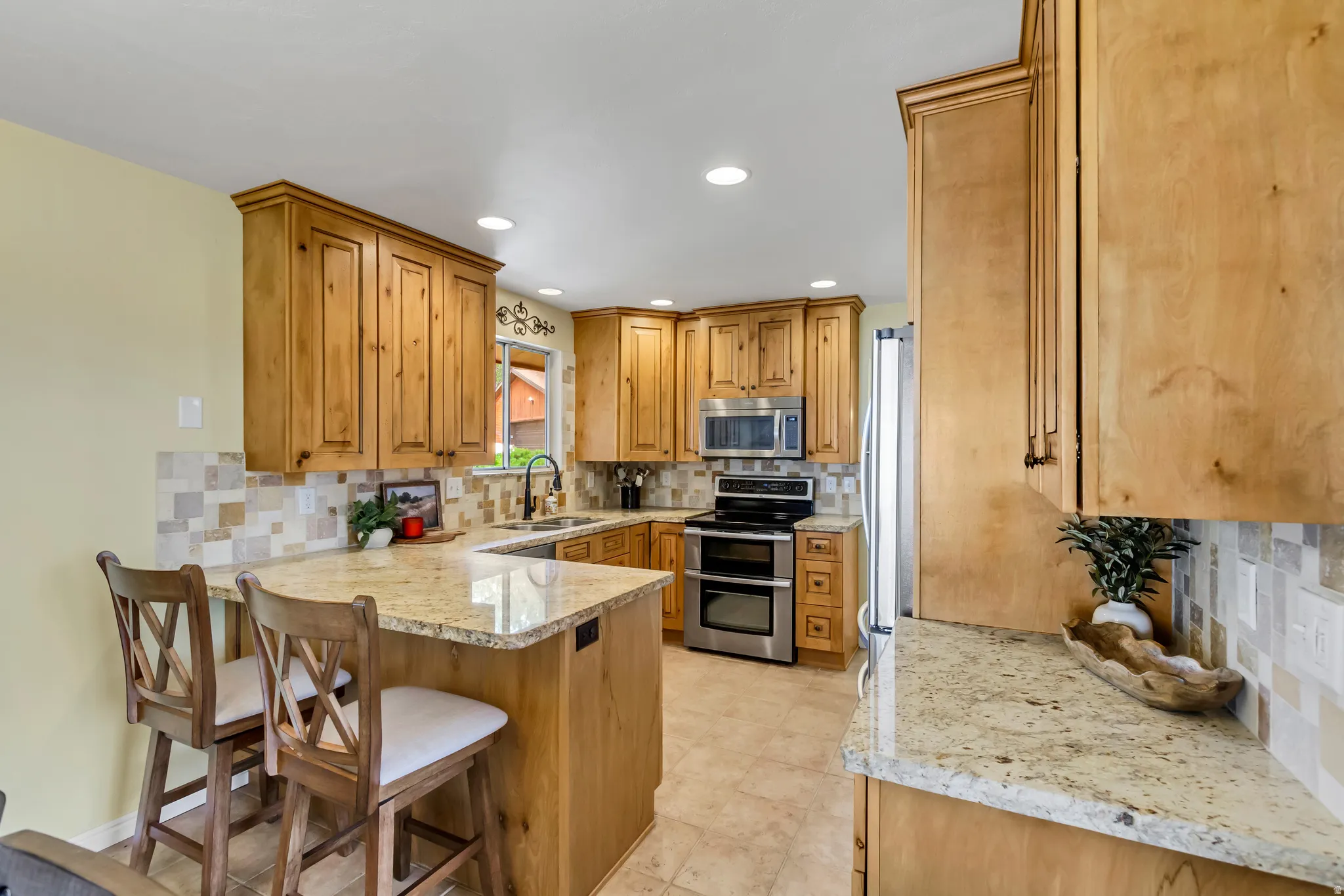 Granite countertops, beautiful cabinetry, double oven, stainless appliances