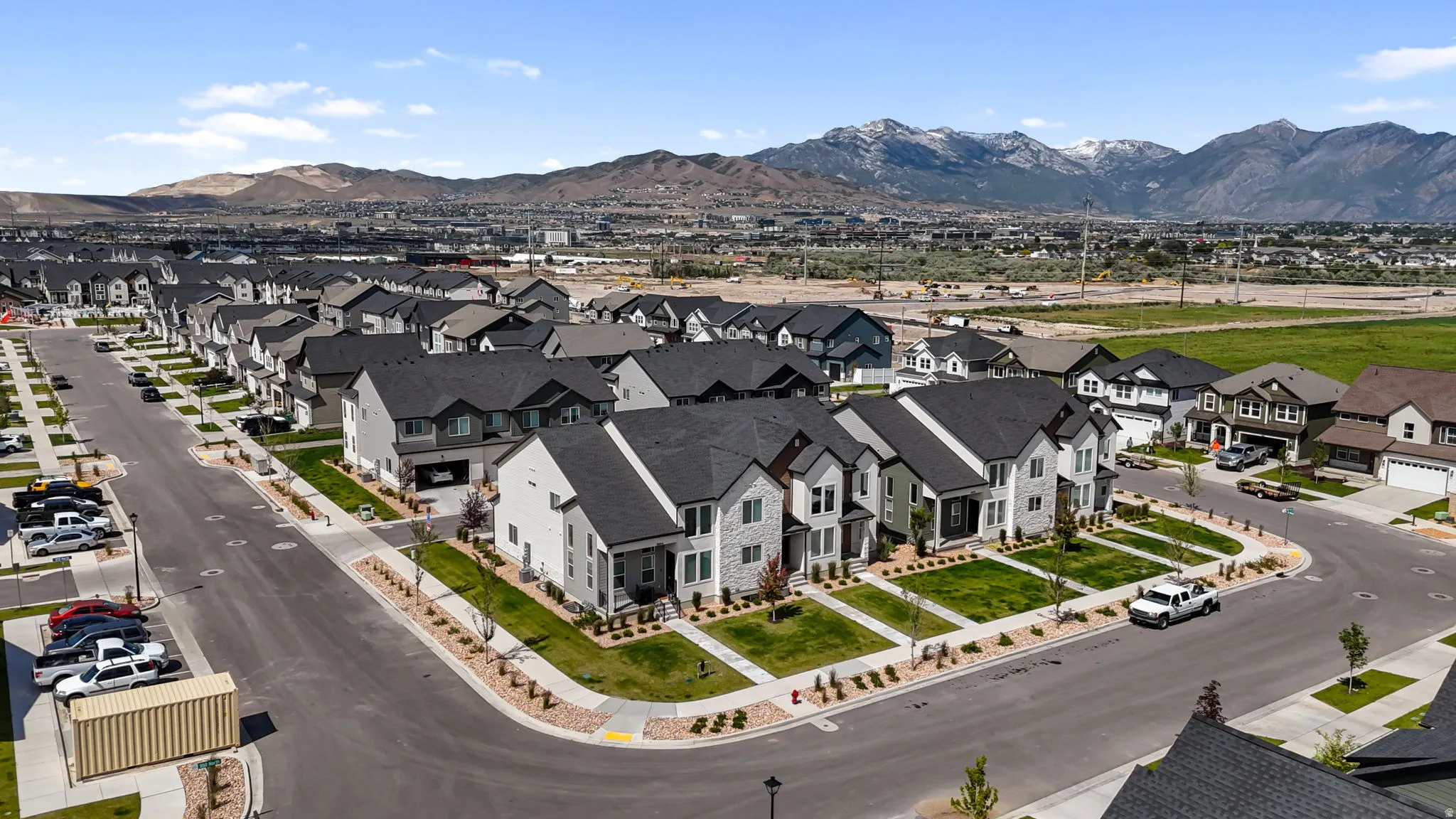 Residential community featuring a variety of architectural styles, manicured lawns, and paved streets