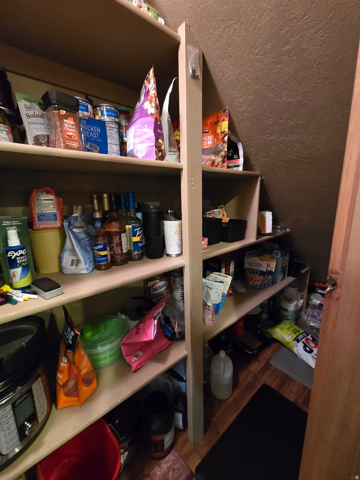 Integrated pantry shelving with light-finish wood