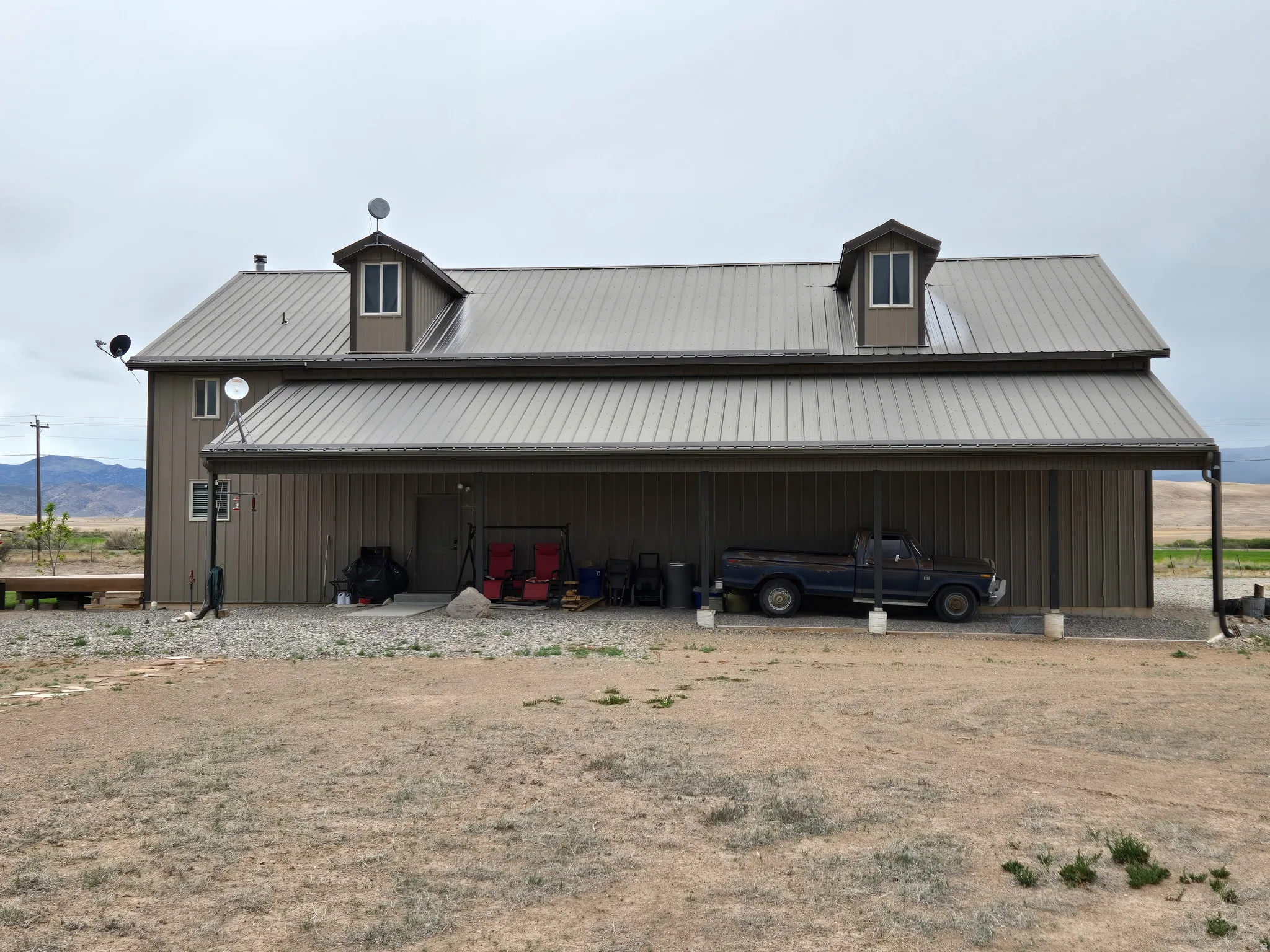 Two-story structure with a metal roof and two dormers