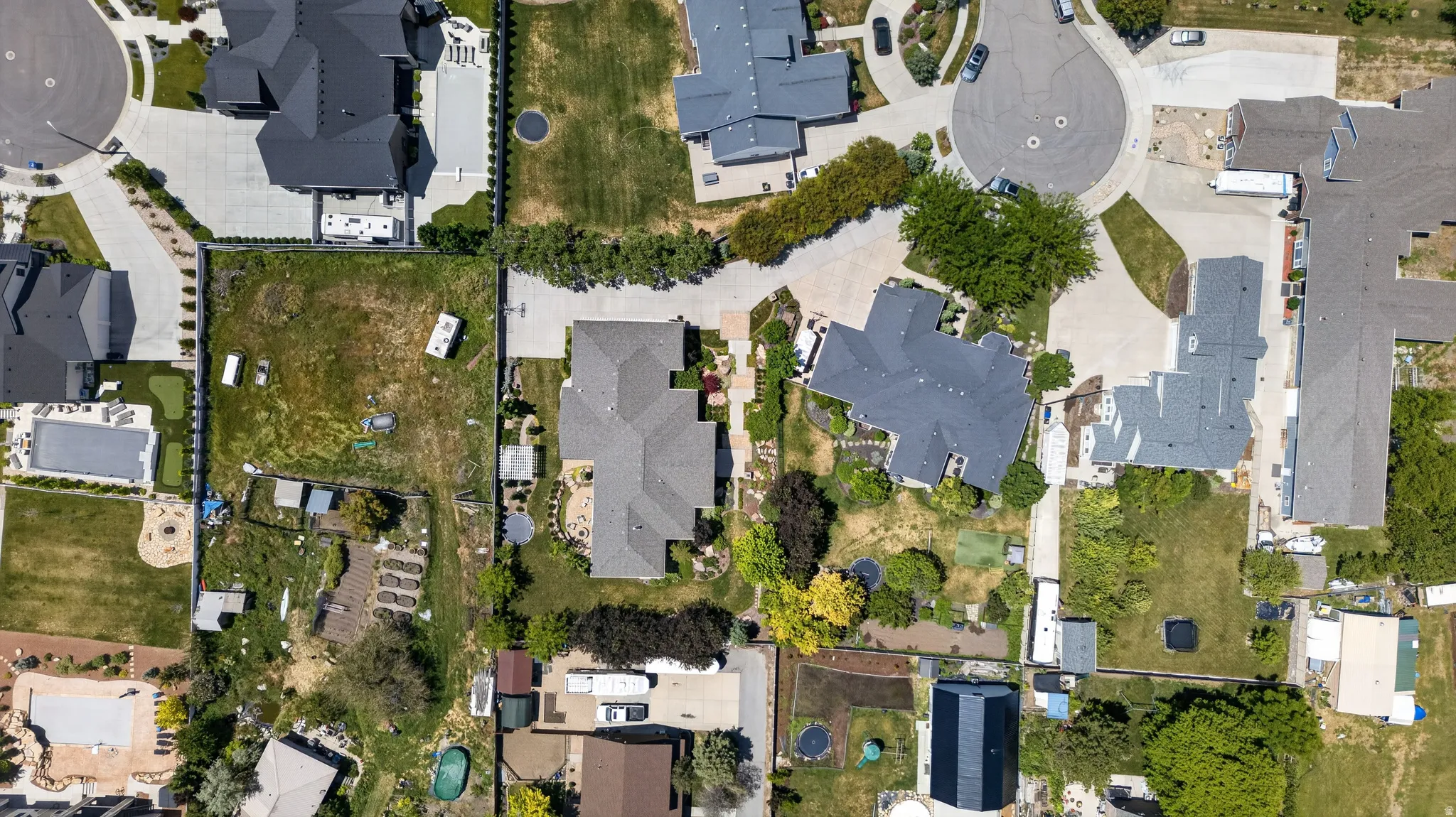 Expansive residential lot featuring undeveloped land and established perimeter fencing