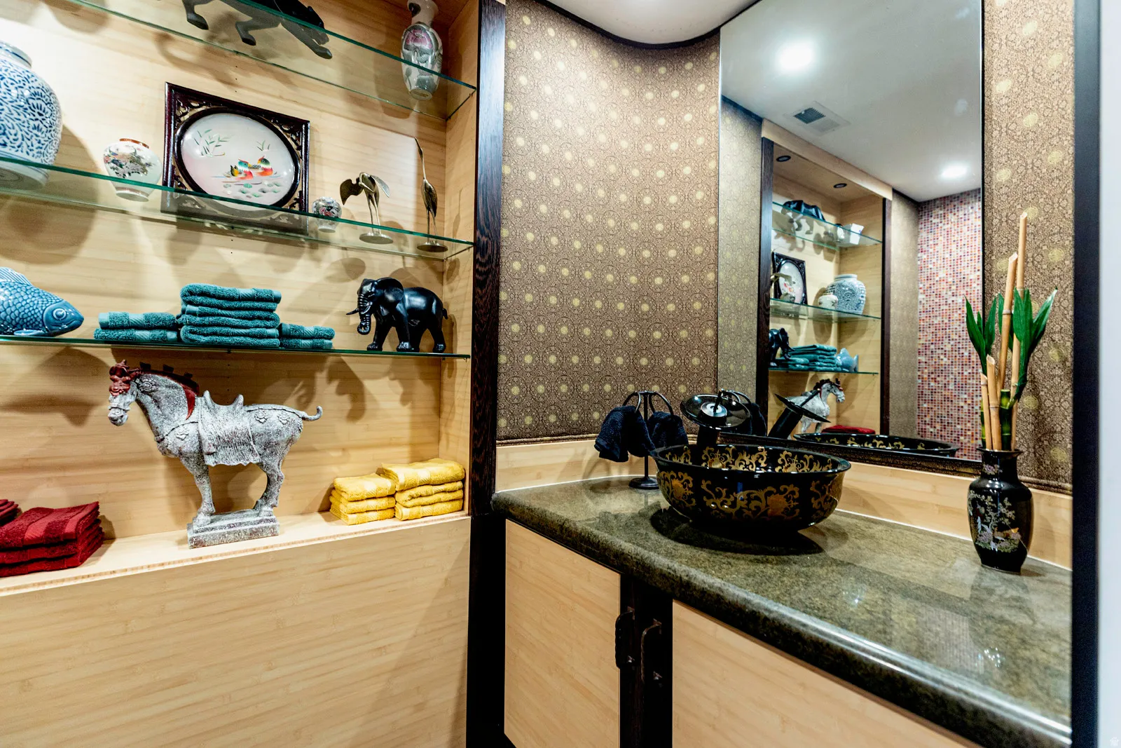 Vanity featuring a decorative vessel sink, stone countertop, and full-wall mirror