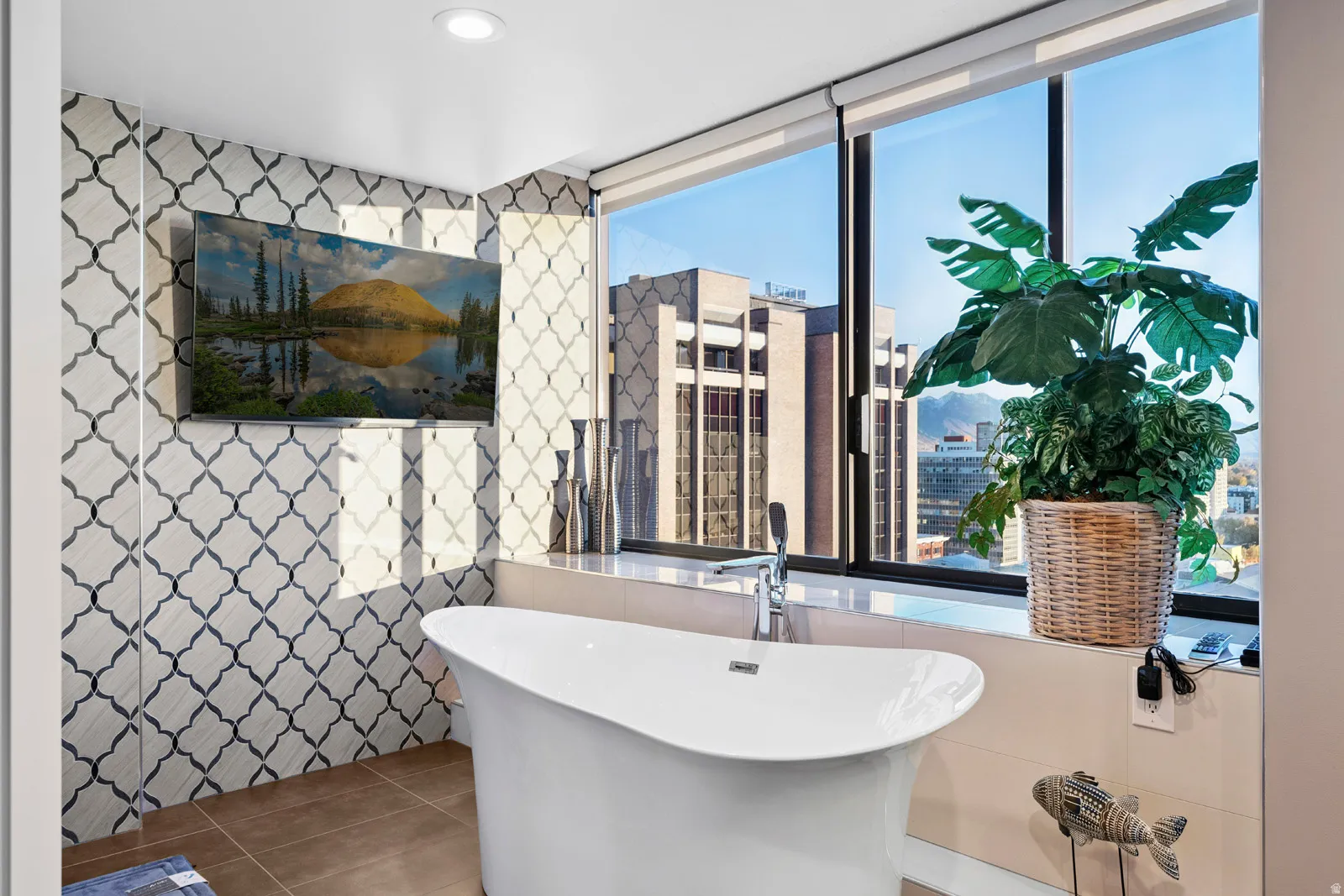 Freestanding soaking tub with floor-mounted faucet