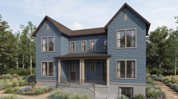Two-story residence featuring blue siding, a covered porch with columns, a dark brown roof, and multiple windows with light-colored trim