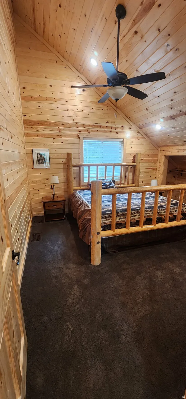 Vaulted ceiling with wood paneling, recessed lighting, and a ceiling fan