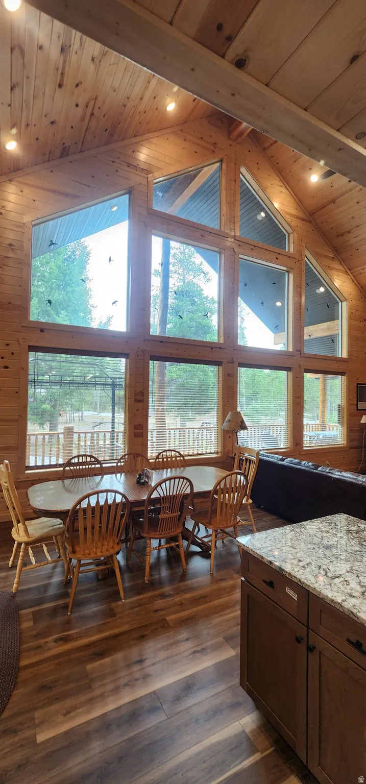 Vaulted wood-paneled ceilings with recessed lighting