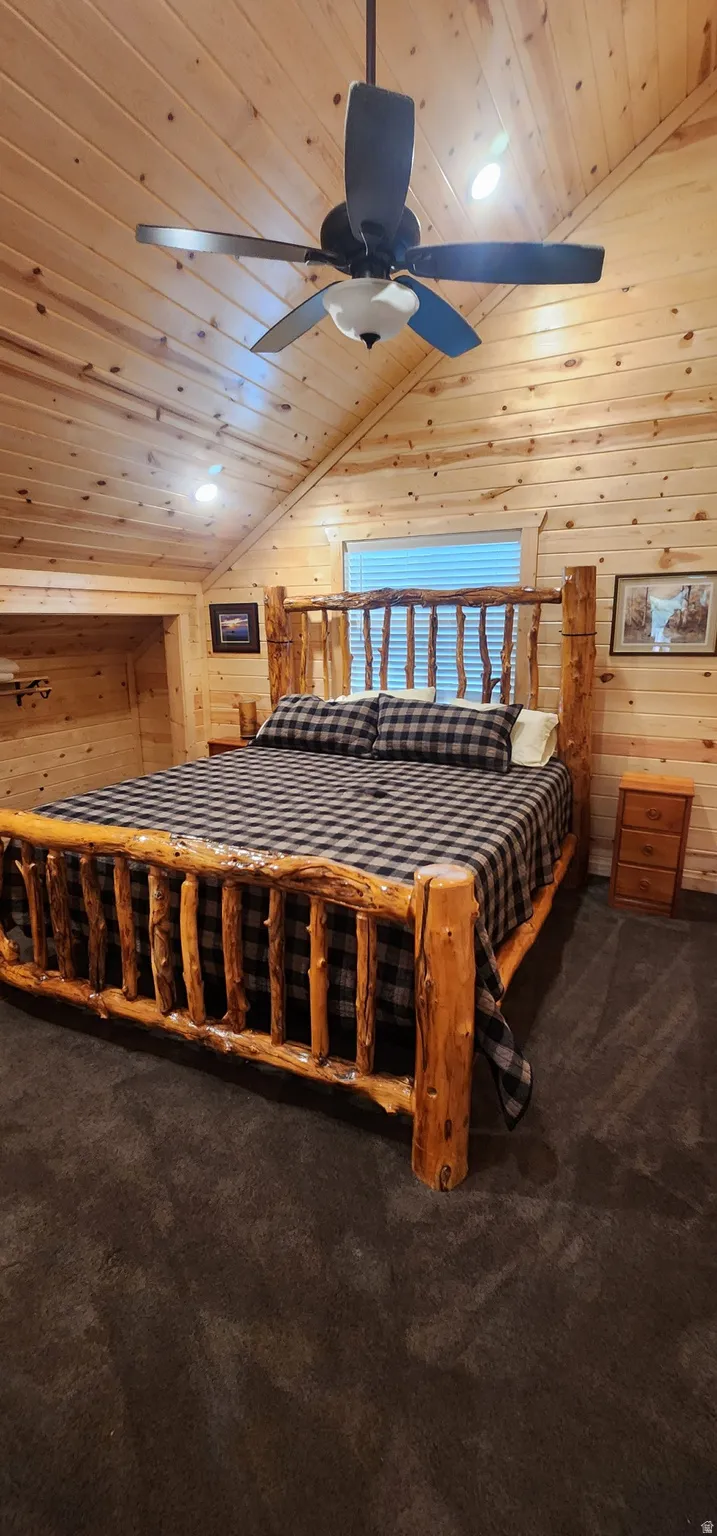 Vaulted wood-paneled ceilings featuring recessed lighting and a ceiling fan