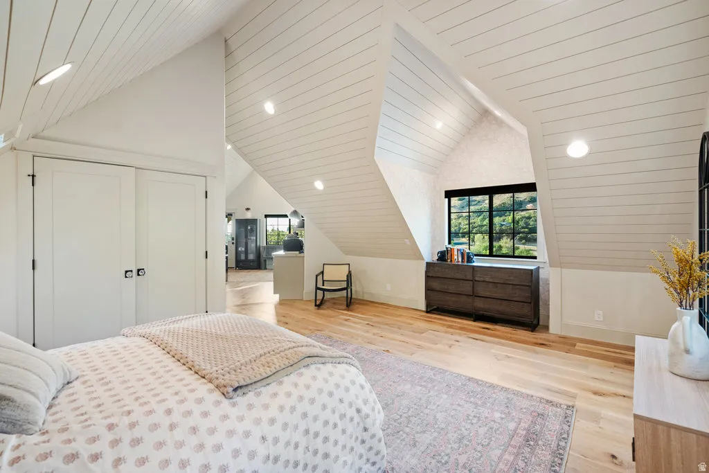 Vaulted ceiling with shiplap accents and recessed lighting