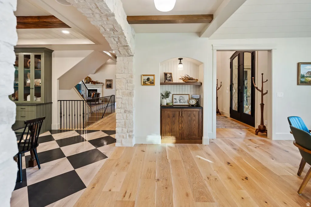 Open concept interior featuring light-toned wood-finish flooring